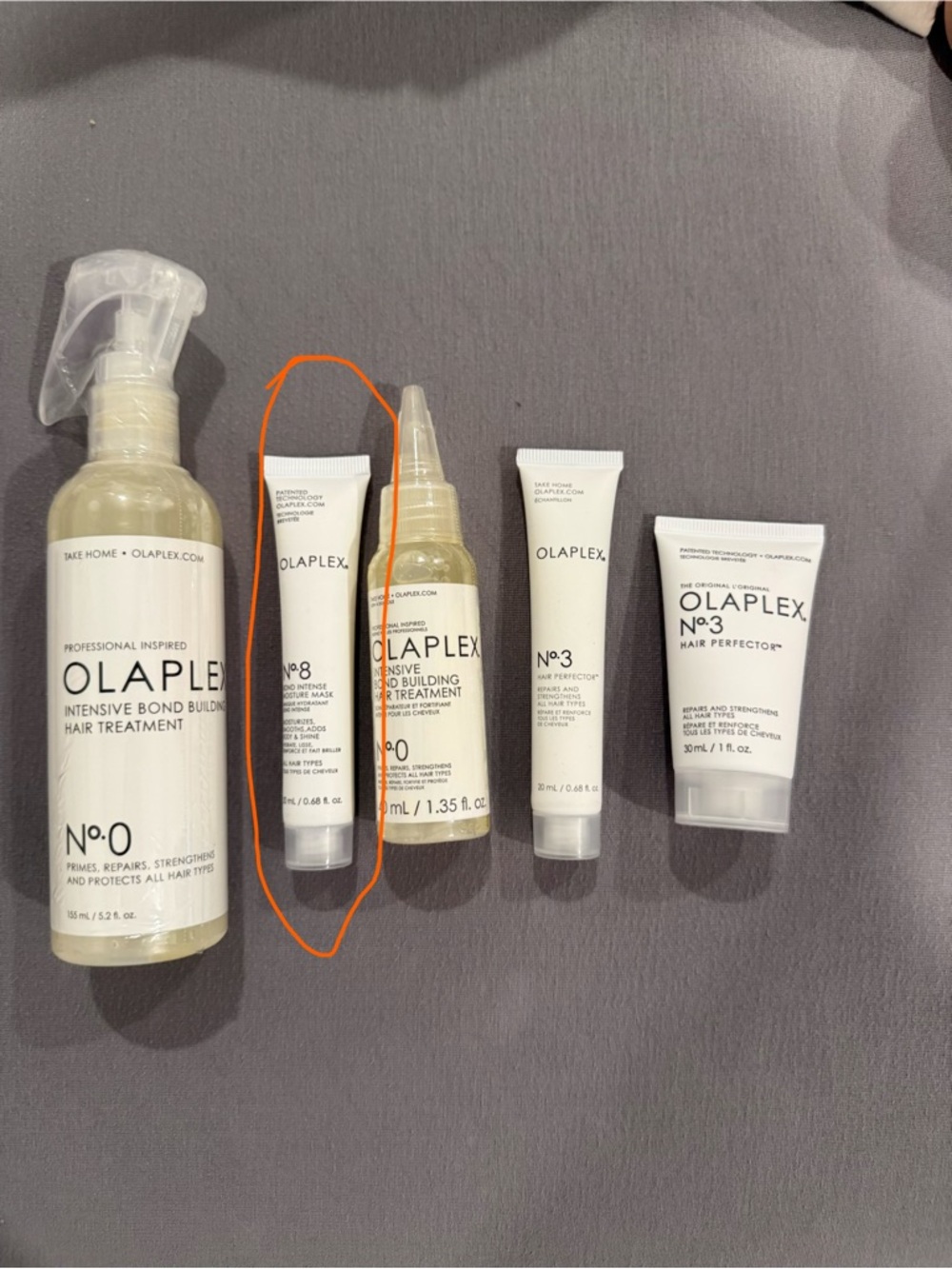 OLAPLEX No.8 Intense Bonding Mask - bottles circled circled in orange